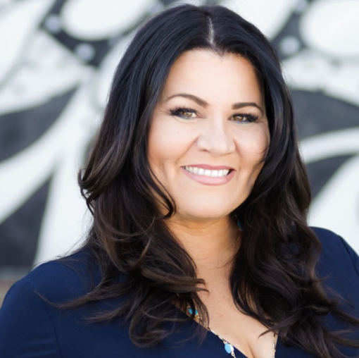 Denise Soler Cox, keynote speaker and author, smiling in a professional portrait